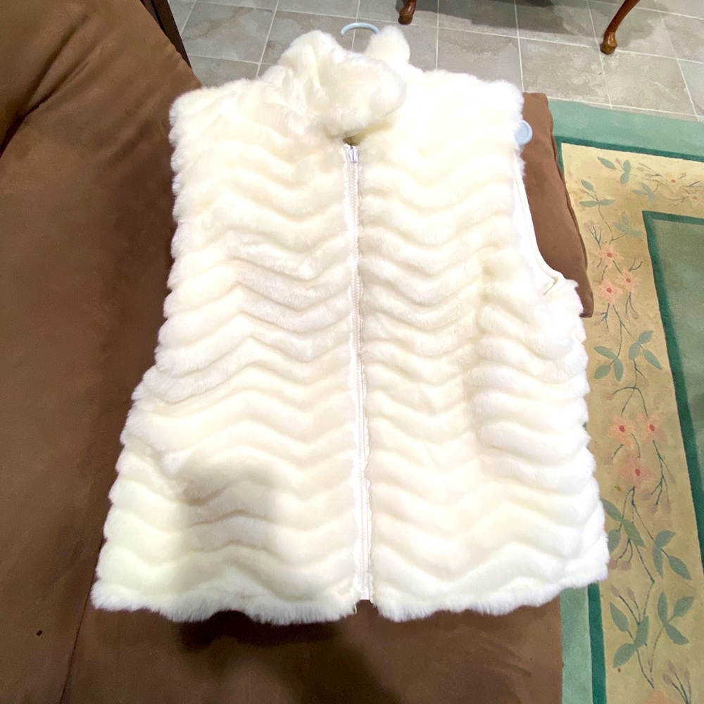White fur vest